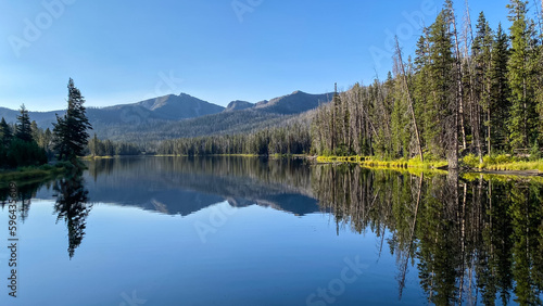 Sylvan Lake morning reflections of the trees and mountains in Yellowstone National Park