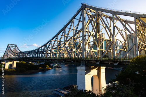 panorama of brisbane cbd on sunset; skyscrapers and famous story bridge in downtown of brisbane city in queensland, australia