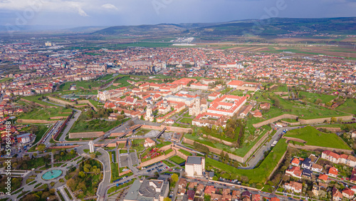 Aerial view of the Alba Carolina citadel located in Alba Iulia, Romania. The photography was shot from a drone with the camera level for a panoramic view of the star shaped citadel.