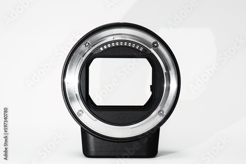 Mirrorless camera lens adapter isolated in white with copy space. 