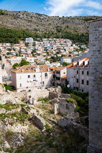 View of an area of ruins surrounded by historic stone buildings located within the walls of the old town of Dubrovnik, Croatia, a remarkably well-preserved UNESCO site.