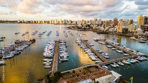 aerial of Punta del Este city Uruguay Atlantic coastline with scenic skyscraper building and skyline drone footage golden hours