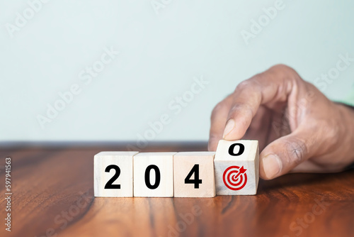  2040 goals of business or life. Team building. Wooden cubes with 2040 and goal icon. Starting to new year. Business common goals for planning new project, annual plan, business target achievement