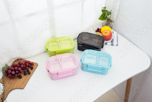 Colored plastic bento cutlery box placed on the table