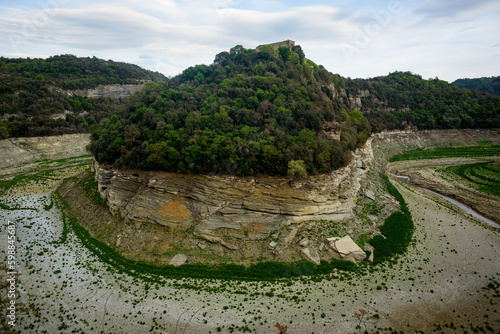 Sau, Spain - 28 April 2023: The Ter river is seen before the Sau reservoir as the drought caused by climate change causes water shortages in Spain and Europe.