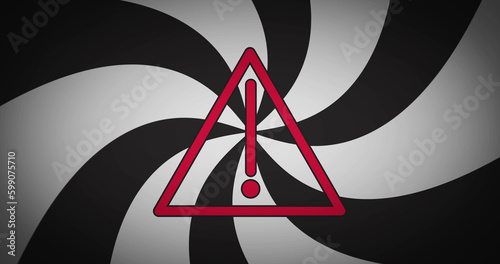 Image of spiral of black and white lines over warning sign