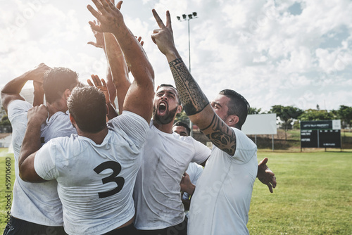 We are the best. a group of cheerful young rugby players celebrating their win after a match outside during the day.