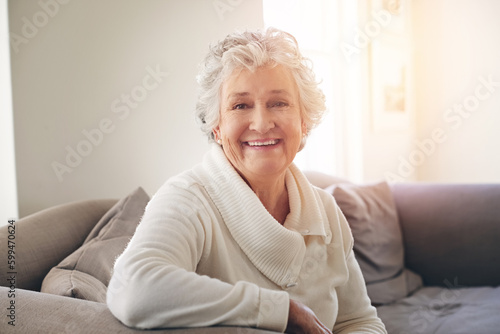 Relax, happy and portrait of old woman on sofa for free time, retirement and weekend. Smile, happiness and mindset with senior person in living room at home for elderly, positive and carefree