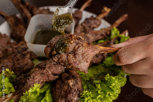 Barbecue - Grilled lamb shoulder with pesto sauce