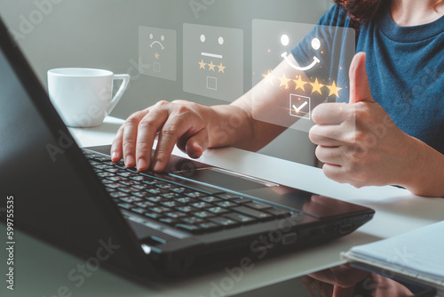 Customer service and Satisfaction concept. Woman showing raised thumbs as a gesture of recommendation or good choice for select smile face icon for client evaluation and customer service satisfaction.