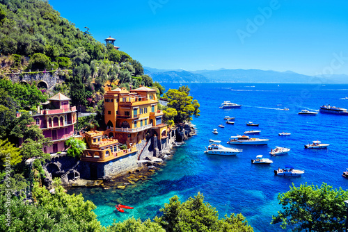 Luxurious seaside villas of Portofino, Italy. Scenic cove with boats in the Mediterranean Sea.