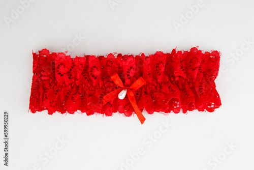 Red garter isolated on white background