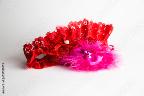 Red-pink garter isolated on white background