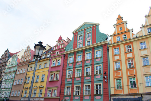 City view of the old buildings with colorful walls, decorative elements on the facades and lantern. Central square, old market with historical buildings. Old town. Poland, Wroclaw, January 2023