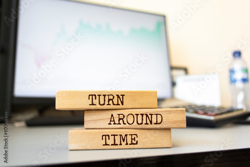 Wooden blocks with words 'Turn Around Time'.