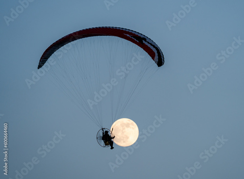 Full Moon and paraglider