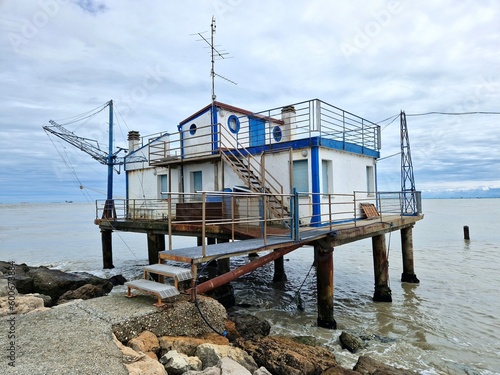 Fishing shack or fishing hut or fishing cabin on pier of Adriatic sea in Italy, Europe