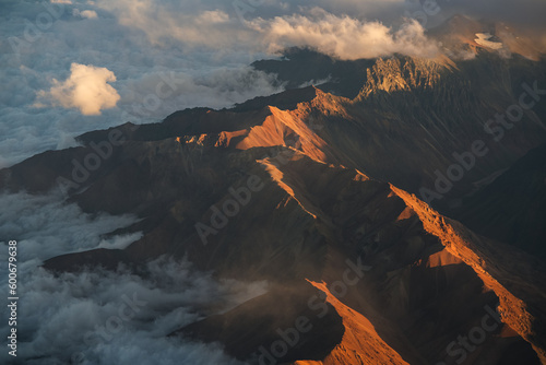 Andes Mountains at sunset. Aerial photo with the amazing sunset landscape over the tallest peaks in South America, part of Andres Mountains.