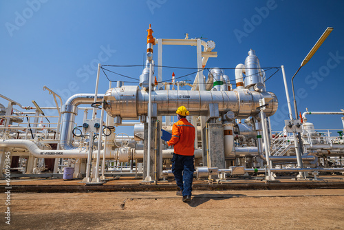 Male worker inspection at the exchanger of tank oil refinery pipeline plant steam vessel and column tank oil of Petrochemistry