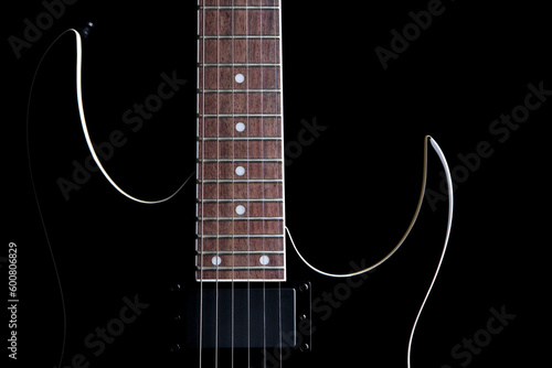 electric guitar silhouette closeup isolated on black