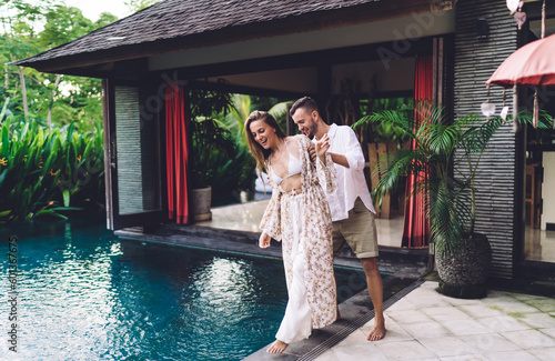 Caucasian boyfriend 30s enjoying relationship with cheerful girlfriend in casual wear, happy male and female best friends bonding during communication leisure for feeling warm vibes on honeymoon