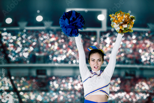 A female cheerleader in action inside a stadium
