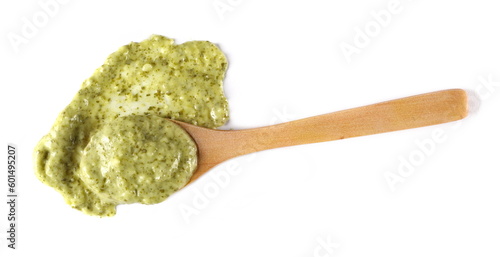 Green mojo sauce, mojo verde, spilled in wooden spoon isolated on white, clipping path 