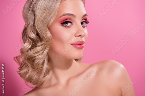 Studio professional photo of chic lady with flawless skin apply hair fixation curls isolated pastel color background