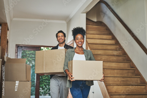 Happy couple, real estate and moving in new home with boxes for renovation, investment or relocation. Interracial man and woman owner carrying box for property rent, mortgage loan or move together