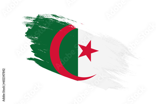 Algeria flag with stroke brush painted effects on isolated white background