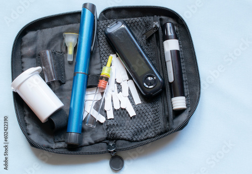 Diabetic kit. glucometer, insulin, lancing device.