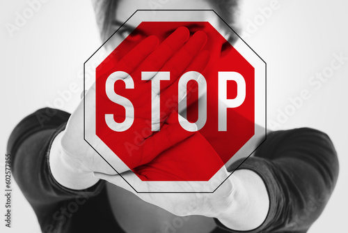 Angry woman and stop sign. Women's rights - stop discrimination, harassment and violence against women