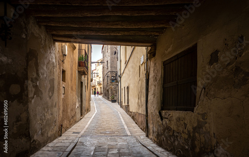 Calaf (Anoia), Catalunya, Spain - May 14, 2023: Narrow cobblestone street