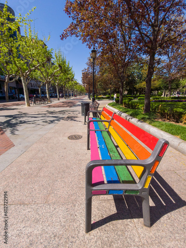 Park bench with the colors of the rainbow and the LGTBI collective