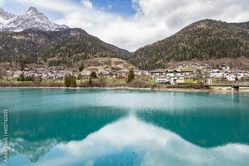 Beautiful view of reflections on Auronzo Lake turquoise water, in Auronzo di Cadore village; Belluno, Dolomites, Italy