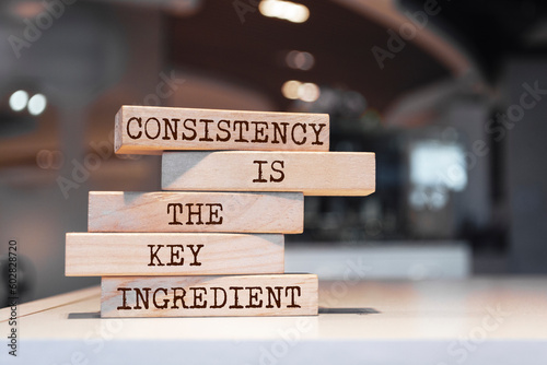 Wooden blocks with words 'Consistency is the key ingredient'.