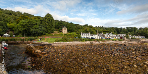 Low tide at Corrie Port, a small harbour in the pretty seaside village of Corrie on the Isle of Arran, Scotland.