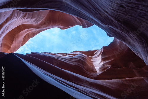 Pink and Orange Sandstone Formations in Antelope Canyon against blue sky