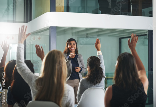 Hands up, black woman or business people in a presentation asking women questions or ideas. Team work, faq or happy female mentor talking, training or speaking to employees in a group discussion