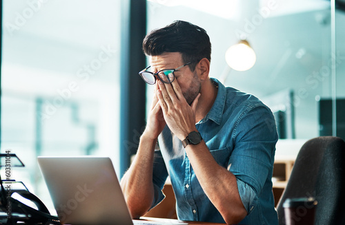 Headache, stress and tired business man at laptop in office for anxiety, debt crisis and eye strain problem. Burnout, fatigue and worker at computer with pain, brain fog and frustrated with mistake