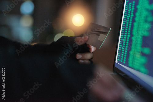 Theft, hands of a hacker with credit card with a laptop and screen of numbers. Illegal or money laundering payments, cyber security and male person stealing capital from account with online software