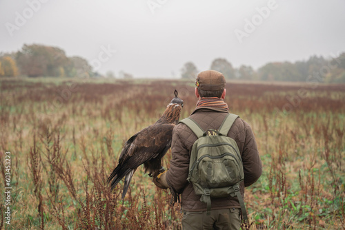 Back hunter with eagle during a hunt in France 
