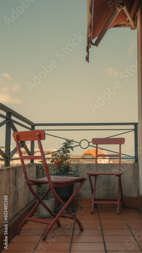 Outdoor terrace with chair and table, vintage filter effect.