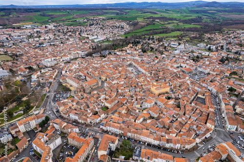 Aerial above the old town of Issoire in France on a sunny day in early spring.