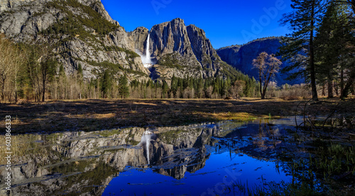 Yosemite Falls with a snow cone and a reflection in the spring, California