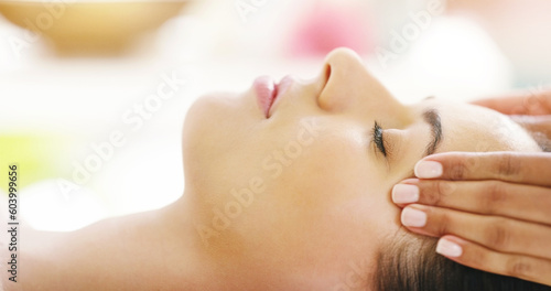 Woman, hands and face sleeping in spa massage for zen, physical therapy or healthy wellness at resort. Calm female person in relax or sleep for luxury facial treatment, body care or relief at salon