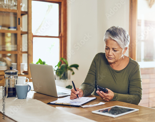 Senior woman, budget planning and health insurance checklist with phone at home. Writing, contract and elderly female person with financial, tax and pension form in a house with bills and debt