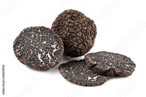 black truffles with slices on white background.