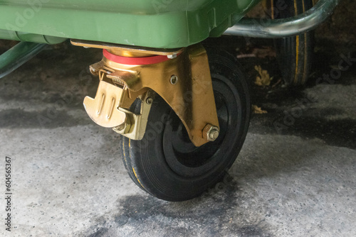 closeup description of heavy duty casters (large wheelie bins) stock images, selective focus.vienna, austria, 16 may 2023