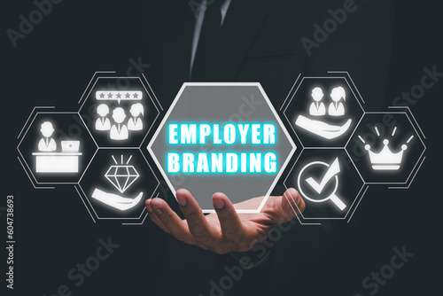 Employer branding concept, Busienssman hand holding employer branding icon on virtual screen.